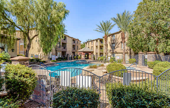 Pool surrounded by fence at Borgata Condominiums, Las Vegas, NV, 89103