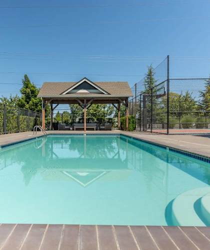 A small pool with a gazebo in the middle of it at Forestplace Apartment Homes, Forest Grove, OR, 97116