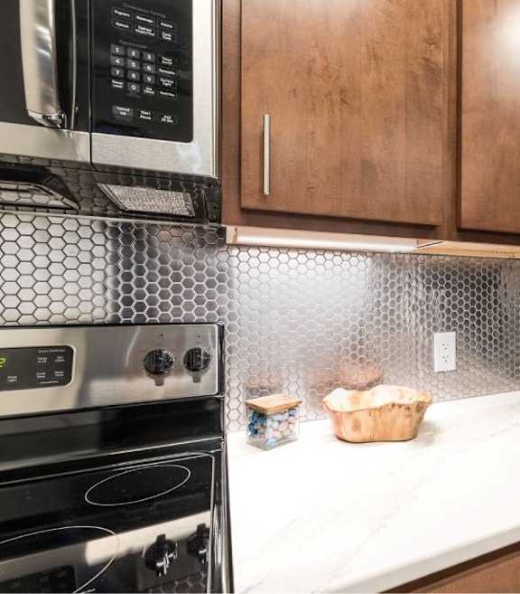 Kitchen Designed With Ample Storage Space at Clemens Building, Des Moines, Iowa