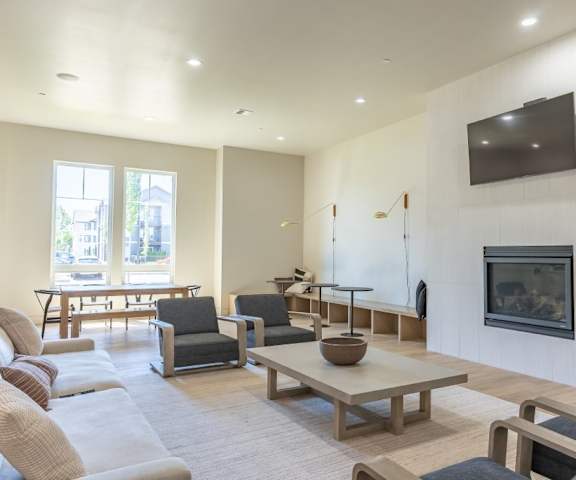 A living room with a television and a fireplace at Northplace Apartment Homes, Oregon