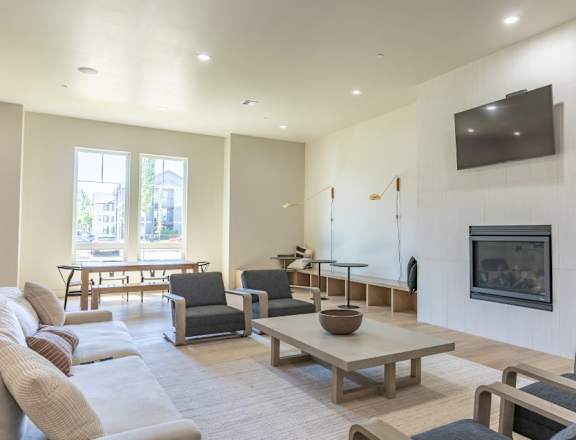 A living room with a television and a fireplace at Northplace Apartment Homes, Oregon