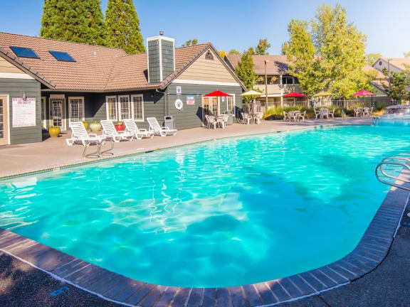 St. Mary's Woods outdoor pool, lounge chairs, tables and ubrellas at St. Mary's Woods Apartments, Beaverton, 97078