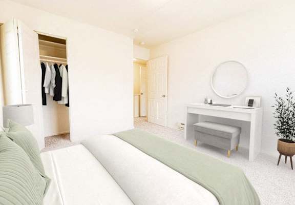 a bedroom with a bed and a vanity with a mirror