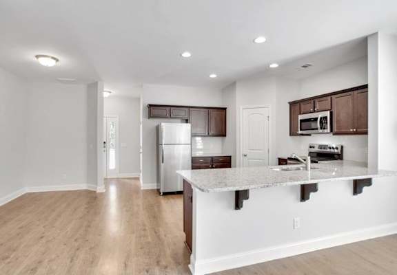 a kitchen with a counter top and a refrigerator