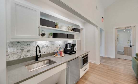 a kitchen with a sink and a counter top
