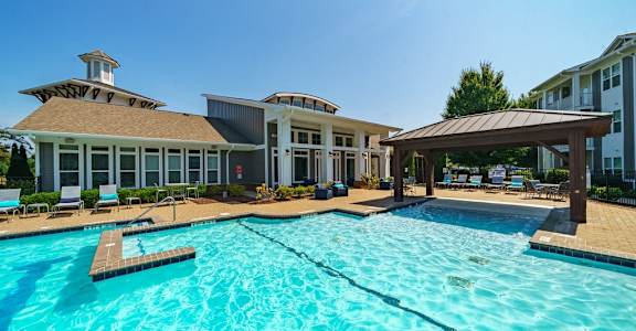the preserve at ballantyne commons pool with apartment buildings in the background