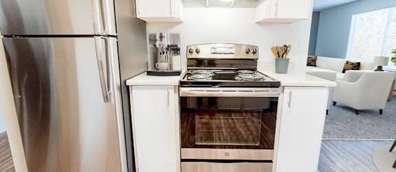 Modern Kitchen with White Appliances at Arbor Pointe, Washington