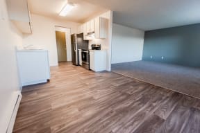 Lakewood Apartments - Arbor Pointe Apartments - Dining Room, Kitchen, Entryway, and Living Room