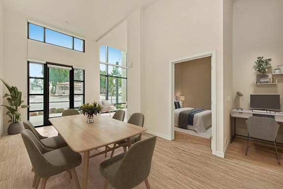 A room with a table and chairs in it.