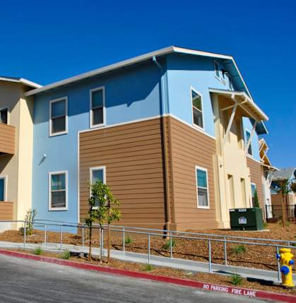 A row of houses with a fire lane in front.