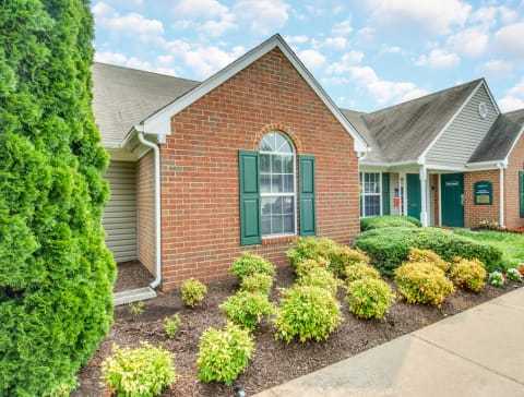 Leasing office exterior with native landscaping