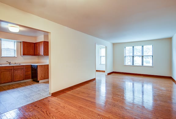 A room with wooden floors and white walls.