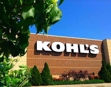 A Kohl's store sign is seen on a brick building.