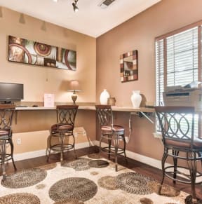 a room for printing with tables and chairs
