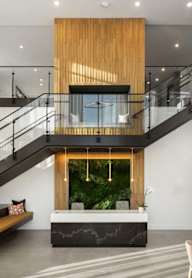 Staircase in the middle of living room view at Alta Davis, North Carolina, 27703
