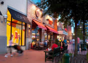 Thumbnail 5 of 9 - a group of people sitting outside of a restaurant