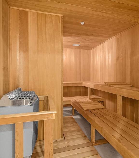 a sauna room with wooden benches and a sink at HIGHGROVE, Stamford, CT, 06901