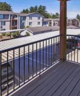 a balcony with a view of a parking lot at Troutdale Terrace, Oregon 97060