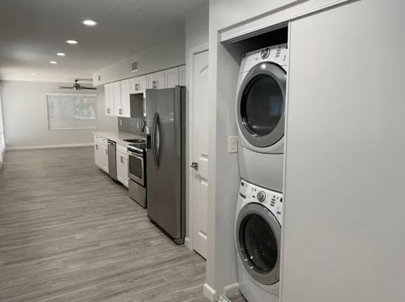 A row of washing machines in a laundry room.