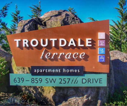 a sign for troutdale terrace apartment homes on a rock at Troutdale Terrace, Oregon