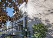 Thumbnail 6 of 7 - A building with a sign that reads "PINEVIEW INSTITUTE" is surrounded by trees and plants.