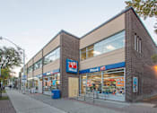 Thumbnail 2 of 6 - A storefront with a blue sign that says "MADE" on it.