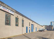 Thumbnail 4 of 6 - A building with a sign that says "DEPOT & DECOR" on it.