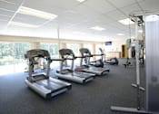 Thumbnail 15 of 17 - Fitness Center with Outside view at Woodridge Apartments, 3901 Noyes Circle, MD 21133