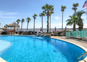 Thumbnail 12 of 19 - Pool with lounge chairs