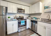 Thumbnail 10 of 32 - Fully Equipped Kitchen at Orion Arlington Lakes, Arlington Heights, IL
