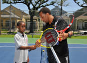 Thumbnail 12 of 29 - Exterior tennis court with players_Lafitte,New Orleans, LA