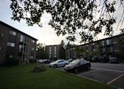 Thumbnail 39 of 45 - parking lot and Apartment building