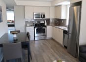Thumbnail 4 of 7 - Kitchen and Dining Area