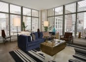 Thumbnail 26 of 35 - Living room and windows at The Citizens Apartments