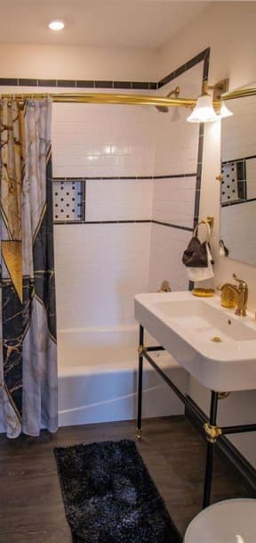 a bathroom with a sink and a toilet and a shower