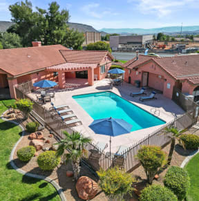 a swimming pool in front of a house