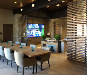 a kitchen with a large island with a marble countertop