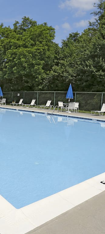 Beautiful private swimming pool with lounge chairs  at Spring Hill Apartments & Townhomes, Baltimore, MD 21234