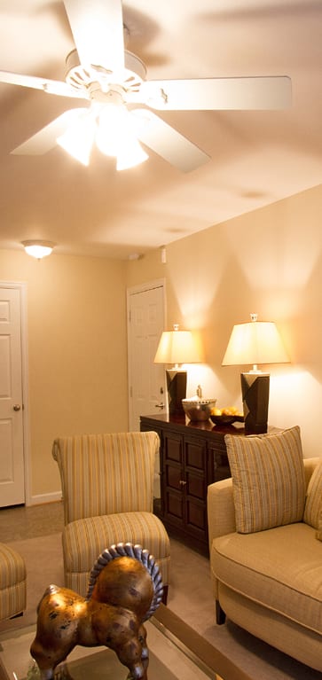 a living room with a couch and chairs at The Summit at Owings Mills Apartments, Owings Mills, MD 21117