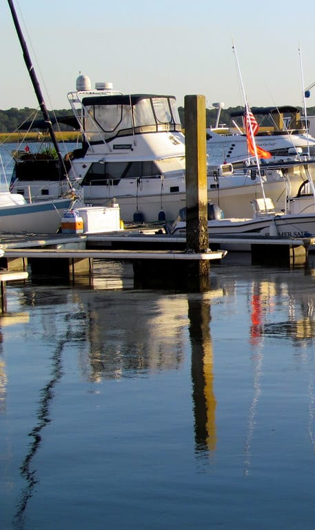 A group of boats are docked at a marina at Diamond Townhomes, Beaufort