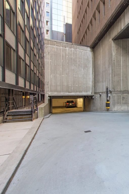A large, empty parking garage with concrete walls and floors.