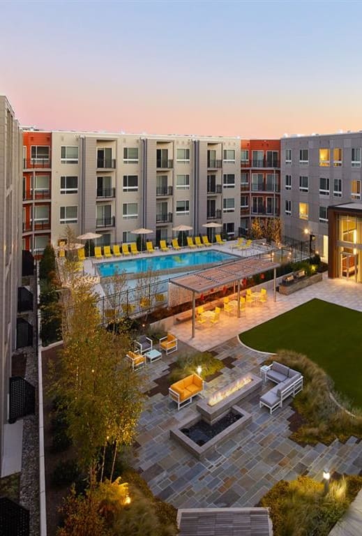 an overhead view of an apartment complex with a pool and lawn at Fort Totten Square, Washington, Washington DC