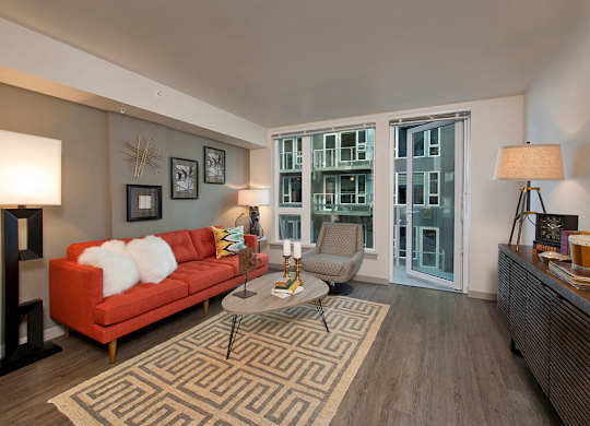 Living room with walk out patio at Infinity Apartments in Seattle WA