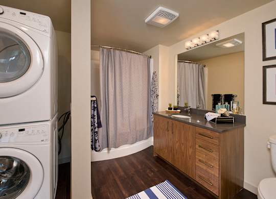 Bathroom with in unit laundry at Infinity Apartments in Seattle WA