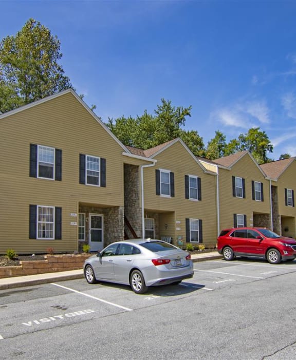 a row of three story houses on a street