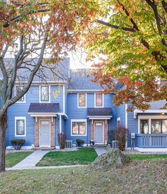 Private entrances to townhomes, sidewalks, and treed area