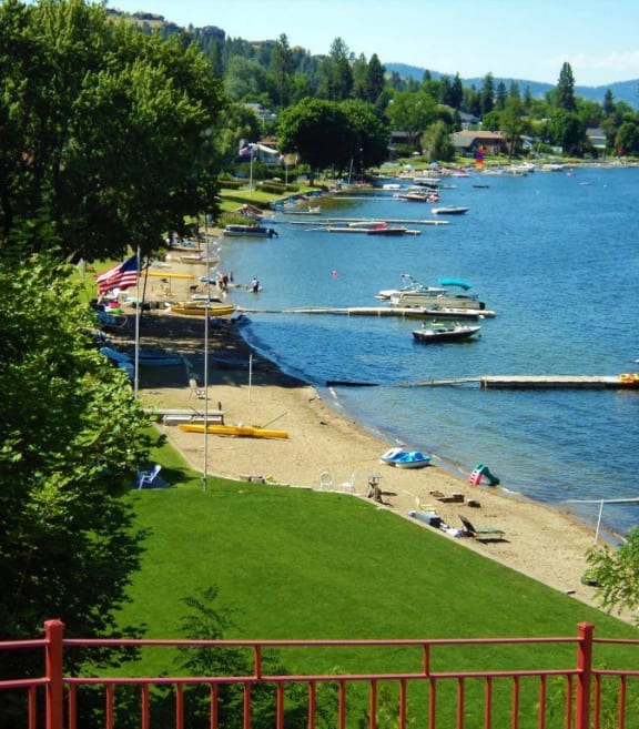 a view of a beach and boats on the water