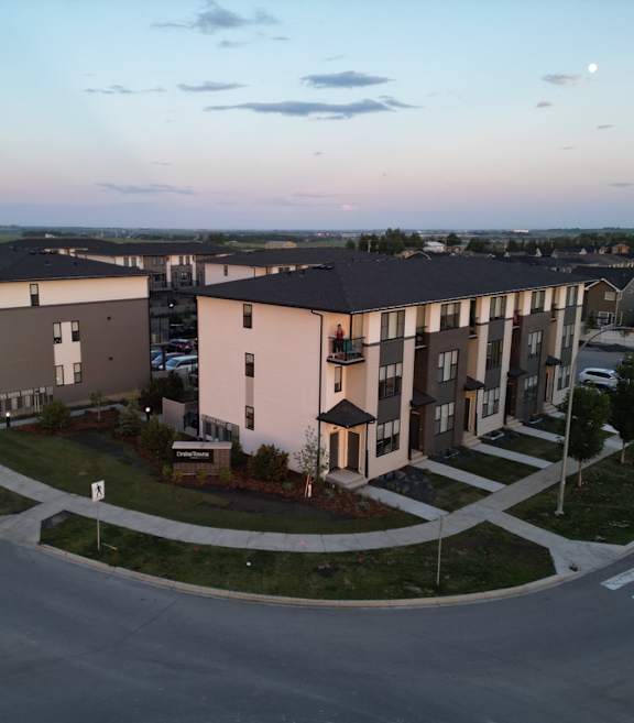 Apartment complex with a roundabout in front.