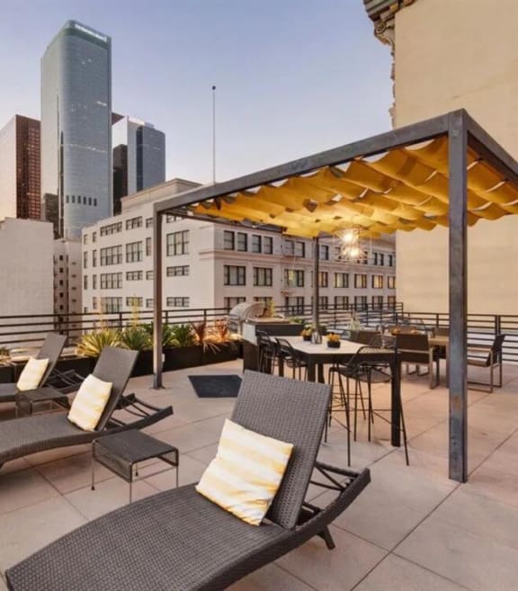 a living room with a couch and a table and a brick wall