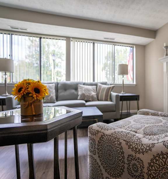 a living room with a couch and a table and a fireplace